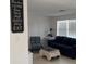 A cozy living room that invites laughter, love, talk, sing, dance, pray, and eat at 6603 Adams St, New Port Richey, FL 34652