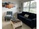 Cozy living room with comfortable seating, beach themed decor and ample natural light at 6603 Adams St, New Port Richey, FL 34652