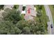 Overhead view showing a well-maintained residential home surrounded by mature trees at 6620 Brambleleaf Dr, Spring Hill, FL 34606