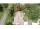 Aerial view showing roof and mature landscaping surrounding the residential home at 6620 Brambleleaf Dr, Spring Hill, FL 34606