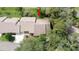 Aerial view of the home, showing its roof and surrounding mature trees at 6620 Brambleleaf Dr, Spring Hill, FL 34606