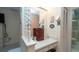 Bathroom vanity area with ample countertop space, built-in drawers, and a bright vanity mirror at 6620 Brambleleaf Dr, Spring Hill, FL 34606