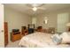 Bright bedroom with a queen bed, desk, and fresh decor creating a comfortable and inviting space at 6620 Brambleleaf Dr, Spring Hill, FL 34606