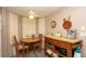 Cozy breakfast nook featuring a ceiling fan and a wooden table at 6620 Brambleleaf Dr, Spring Hill, FL 34606