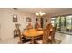 Open dining room showcasing a chandelier and view to the outside patio at 6620 Brambleleaf Dr, Spring Hill, FL 34606