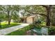 Charming single-story home featuring a manicured lawn, stone accents, and a two-car garage at 6620 Brambleleaf Dr, Spring Hill, FL 34606