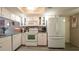 Well-equipped kitchen with a view to the dining and living room area at 6620 Brambleleaf Dr, Spring Hill, FL 34606
