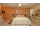 Spacious main bedroom features a large bed, neutral decor, and abundant natural light, perfect for relaxation at 6620 Brambleleaf Dr, Spring Hill, FL 34606