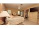 Comfortable bedroom featuring neutral tones, tile floors, ceiling fan, and a large closet at 6620 Brambleleaf Dr, Spring Hill, FL 34606