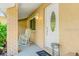 Inviting front porch with a rocking chair, creating a cozy and welcoming entryway to the home at 6656 Pinecrest N Ln, Pinellas Park, FL 33781