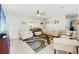 Spacious living room with ample seating and natural light, perfect for relaxing and entertaining at 6656 Pinecrest N Ln, Pinellas Park, FL 33781
