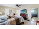 Well-decorated main bedroom featuring natural light and a mirrored closet at 6656 Pinecrest N Ln, Pinellas Park, FL 33781