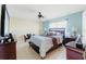 Cozy main bedroom with a large bed, soft lighting, and ample space at 6656 Pinecrest N Ln, Pinellas Park, FL 33781