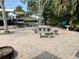 Outdoor patio with seating area and waterfront views, perfect for relaxation and enjoying scenic surroundings at 7104 Fair Ln, Hudson, FL 34667