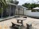 Charming backyard patio perfect for relaxation and entertaining, with comfortable seating and serene views at 7104 Fair Ln, Hudson, FL 34667