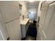 Clean bathroom with sleek vanity, sink, and storage, complemented by modern fixtures at 7104 Fair Ln, Hudson, FL 34667