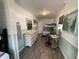 Charming bedroom with a bunk bed, a desk, and light wood-look vinyl flooring at 7104 Fair Ln, Hudson, FL 34667
