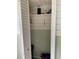 View of an open storage closet with shelving and a black waste basket at 7104 Fair Ln, Hudson, FL 34667