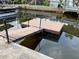 Private dock extending into tranquil waters, providing a serene escape and access to boating and water activities at 7104 Fair Ln, Hudson, FL 34667