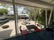 Enclosed lanai offering waterfront views, creating an ideal setting for relaxation and gatherings at 7104 Fair Ln, Hudson, FL 34667