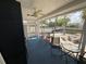 Spacious enclosed lanai featuring comfortable seating and views of the waterfront at 7104 Fair Ln, Hudson, FL 34667