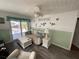 Comfortable living room featuring a ceiling fan, modern decor, and bright, airy atmosphere at 7104 Fair Ln, Hudson, FL 34667