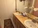 A well-lit bathroom showcases a double sink vanity and a large mirror, enhancing the room's functionality at 7323 Ray Browning Rd, Brooksville, FL 34601