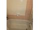 A built-in bathtub with tile surround creates a relaxing space for soaking, adding comfort to the bathroom at 7323 Ray Browning Rd, Brooksville, FL 34601