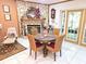 Dining area with a stone fireplace, and dining table for four at 7323 Ray Browning Rd, Brooksville, FL 34601