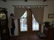 Entryway with tiled floor, unique front doors, and decorative furnishings at 7323 Ray Browning Rd, Brooksville, FL 34601
