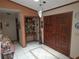 Welcoming foyer with tiled floors, classic light fixture, and decorative accents at 7323 Ray Browning Rd, Brooksville, FL 34601