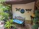 Charming garden seating area with unique decor and lush greenery at 7323 Ray Browning Rd, Brooksville, FL 34601
