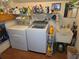 A well-equipped laundry room features modern washer and dryer units, accompanied by a utility sink at 7323 Ray Browning Rd, Brooksville, FL 34601