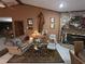 Inviting living room with stone fireplace, unique decor, and cozy seating arrangement at 7323 Ray Browning Rd, Brooksville, FL 34601