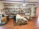 Living room showcasing extensive shelving with desk and sofa at 7323 Ray Browning Rd, Brooksville, FL 34601