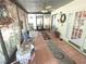 Relaxing sunroom with comfortable seating, tiled floor, and serene outdoor views at 7323 Ray Browning Rd, Brooksville, FL 34601