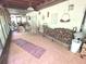 Large sunroom with wood storage, tile flooring, and outdoor views at 7323 Ray Browning Rd, Brooksville, FL 34601