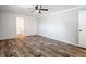 Empty bedroom with wood-look flooring, neutral walls, and a ceiling fan at 7353 Thorpp Ave, Brooksville, FL 34613