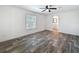 Empty bedroom featuring wood-look flooring and a ceiling fan at 7353 Thorpp Ave, Brooksville, FL 34613