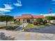 Community clubhouse featuring a ramp, landscaped garden, and American flag at 7353 Thorpp Ave, Brooksville, FL 34613