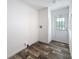 Entryway with wood-look floors, white door with glass windows and door hardware installed at 7353 Thorpp Ave, Brooksville, FL 34613