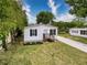 Charming single-story home featuring a quaint porch and well-manicured front lawn at 7353 Thorpp Ave, Brooksville, FL 34613
