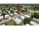 Aerial view of a charming neighborhood street surrounded by mature trees and lush landscaping at 7353 Thorpp Ave, Brooksville, FL 34613