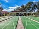 Shuffleboard courts with benches and shade, perfect for outdoor recreation and relaxation at 7353 Thorpp Ave, Brooksville, FL 34613