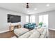 Bright living room featuring modern furnishings, a ceiling fan, recessed lighting, and wood-look flooring at 7523 Tangle Brook Blvd, Gibsonton, FL 33534