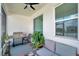 Cozy covered patio featuring a grill, modern seating, and peaceful backyard views at 7523 Tangle Brook Blvd, Gibsonton, FL 33534