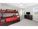 Cozy bedroom with a bunk bed, dresser, ceiling fan, and a bright window at 8084 Nightingale Rd, Weeki Wachee, FL 34613