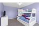 Comfortable bedroom with bunk beds, a dresser, and ample natural light at 8084 Nightingale Rd, Weeki Wachee, FL 34613