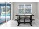 Casual dining area with access to the screened lanai and pool at 8084 Nightingale Rd, Weeki Wachee, FL 34613