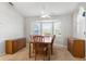 Dining room with a wooden table, chairs, and a ceiling fan at 8084 Nightingale Rd, Weeki Wachee, FL 34613